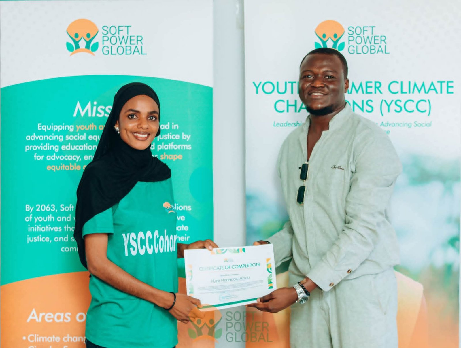 Soft Power Global founder posing with a YSCC graduating fellow.