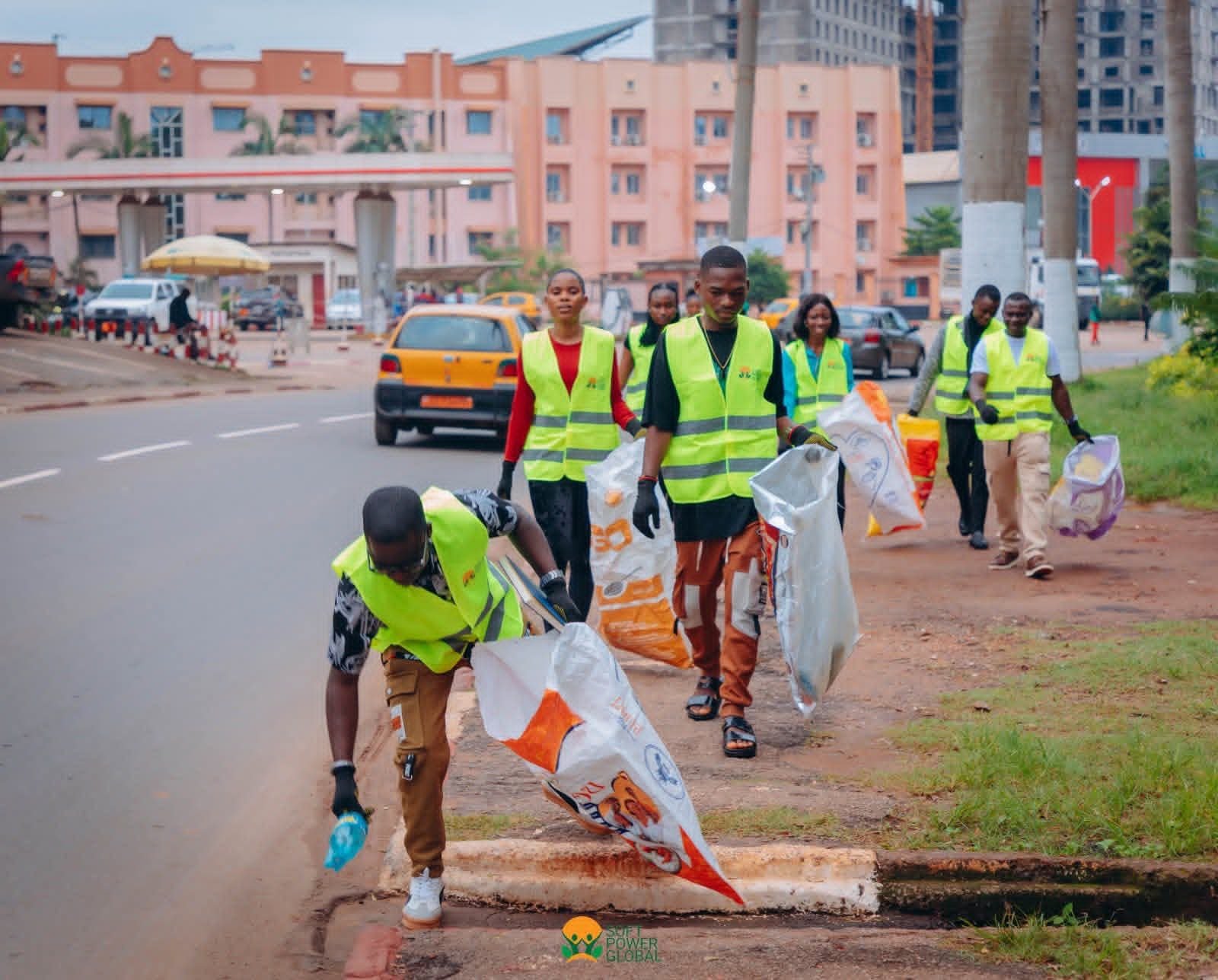 Eco-Walk volunteers collect rubbish along a Yaounde street.